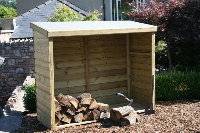 Wooden log store with an open front, filled with chopped firewood and an axe resting on the ground.